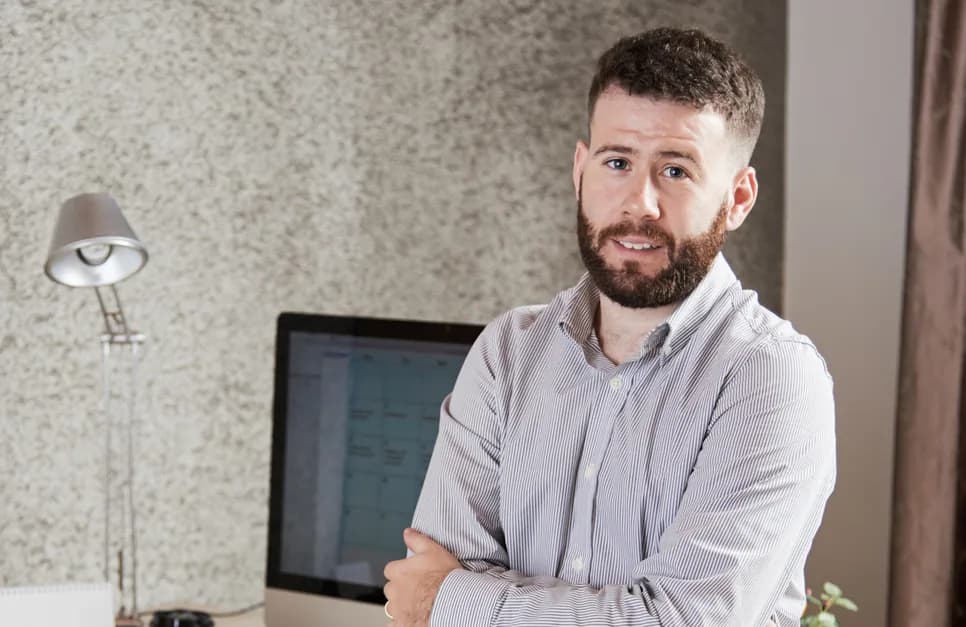 Managing director of Sitelog with arms crossed